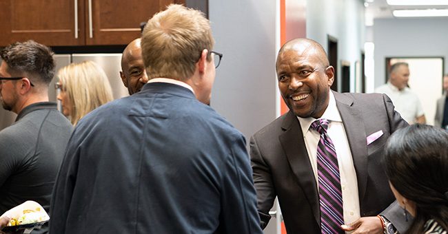 Black Chamber of Arizona CEO Robin Reed shakes hands with STN Partner Executive Mathew Blades at the STN studios before the taping of Episode 10 of It Happens at STN. (STN/ Brett Haehl)