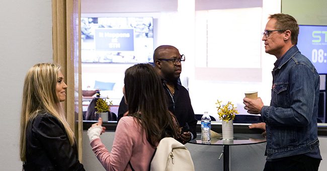 Guests chat in the STN offices before the taping of the third episode of It Happens at STN on November 3, 2022. (STN/Brett Haehl)